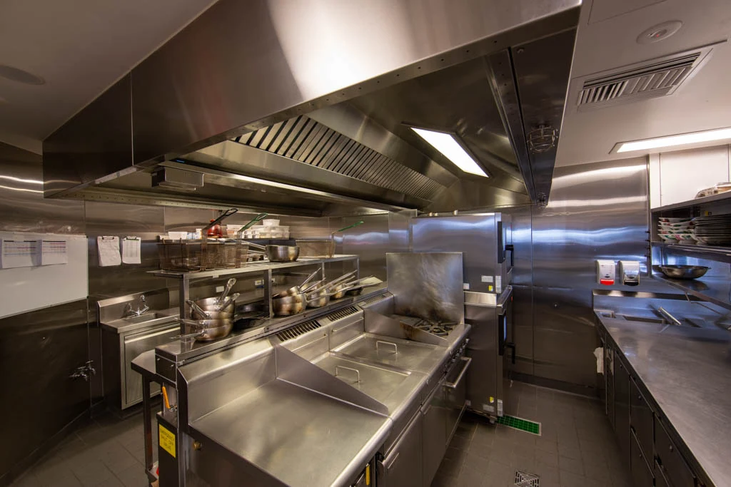 Commercial kitchen ventilation hood with integrated lighting